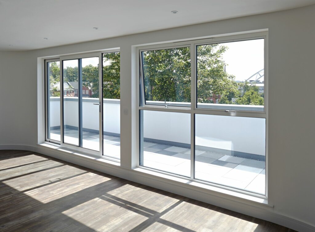 2 | GFD Homes sliding patio doors: white sliding doors opening onto a balcony.
