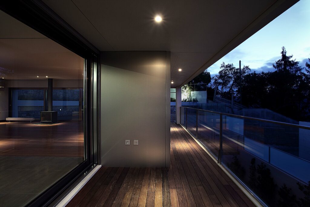 foto-1 | GFD Homes sliding patio doors: sliding doors installed on a home with a balcony view, sunset view.