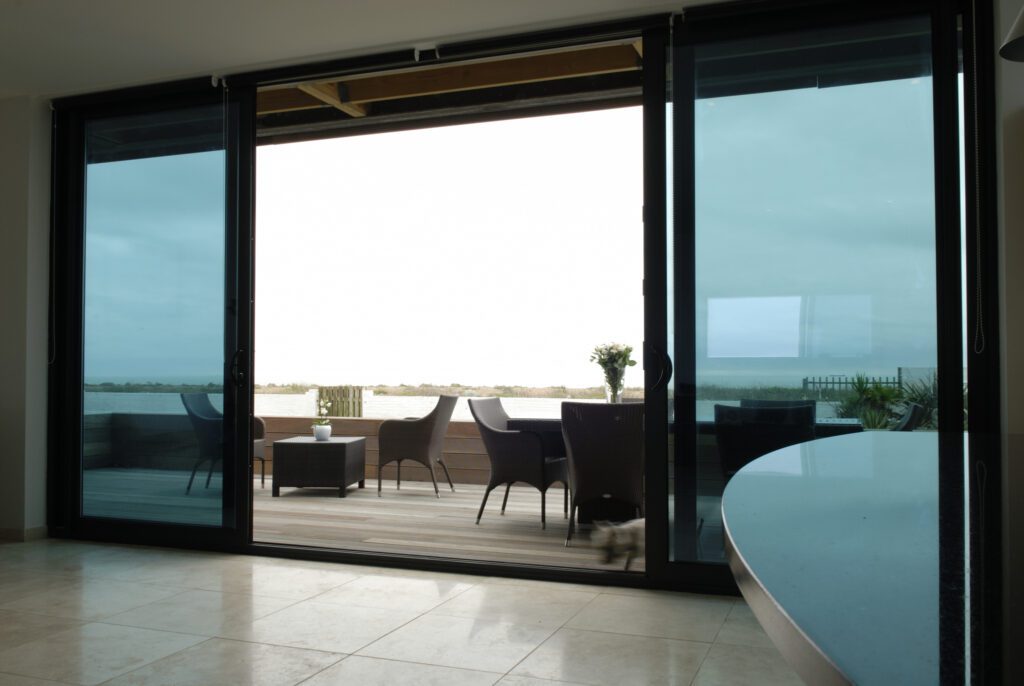 smart079 | GFD Homes sliding patio doors: sliding doors opening onto a patio.