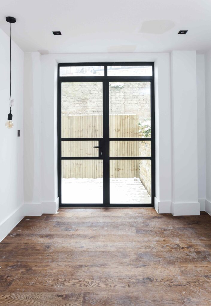 Heritage-Door-1 | GFD Homes Industrial-style windows: industrials style door installed in property.
