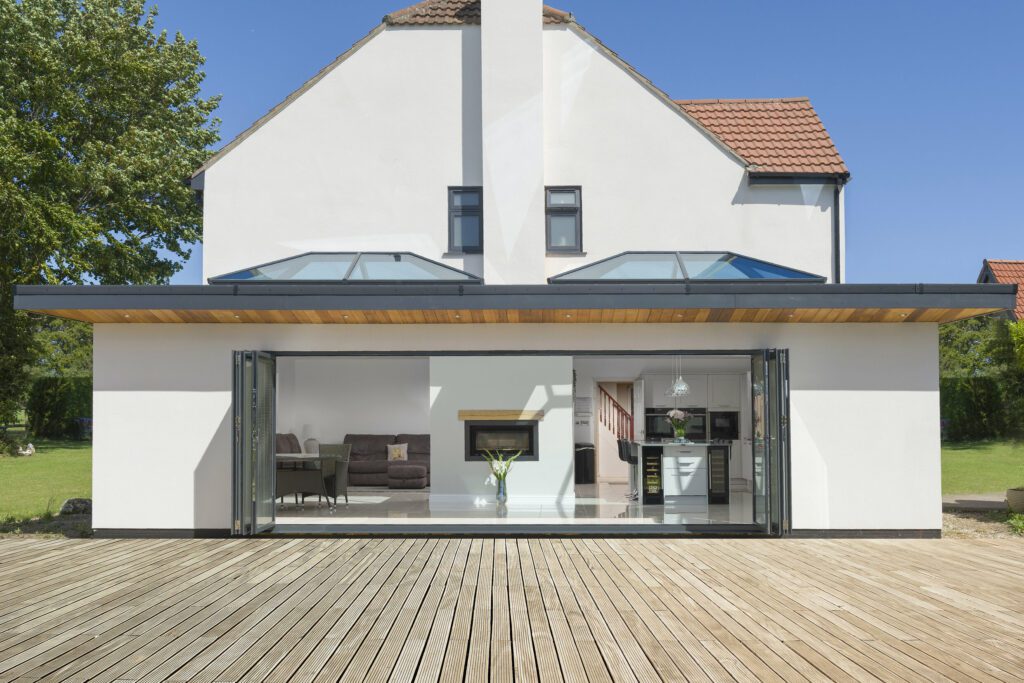 rsz_external_layout | GFD Homes folding door: Korniche bifold opening out onto the patio and Korniche lanterns installed on the roof.