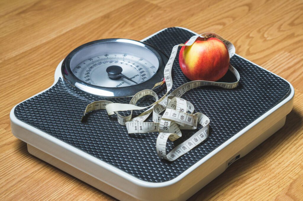 Screenshot-2022-04-14-at-10.30 | GFD Homes hot tub advantages: weighing scales on the floor with a measuring tape and apple on top.