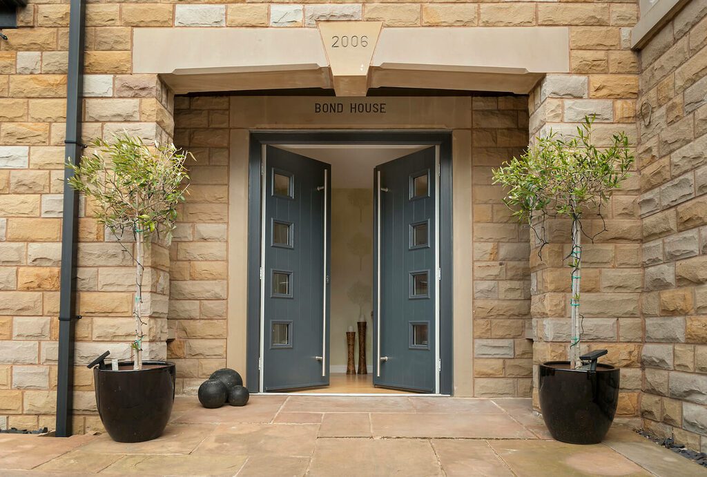 Composite doors can also be specified as double or ‘French’ doors. Example shown is a Solidor Milano in Anrthracite Grey with designer bar handles.