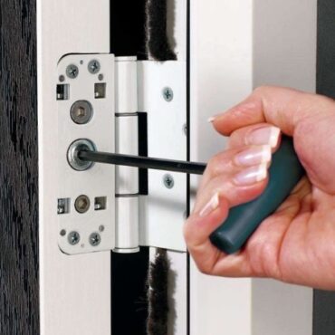 Picture-5-370x370-1 | GFD Homes Person turning screws in a door hinge.