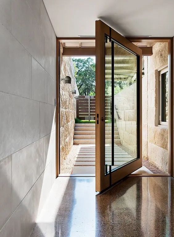 image-1 | GFD Homes alternative to bifold doors: Pivot entrance door half opened.