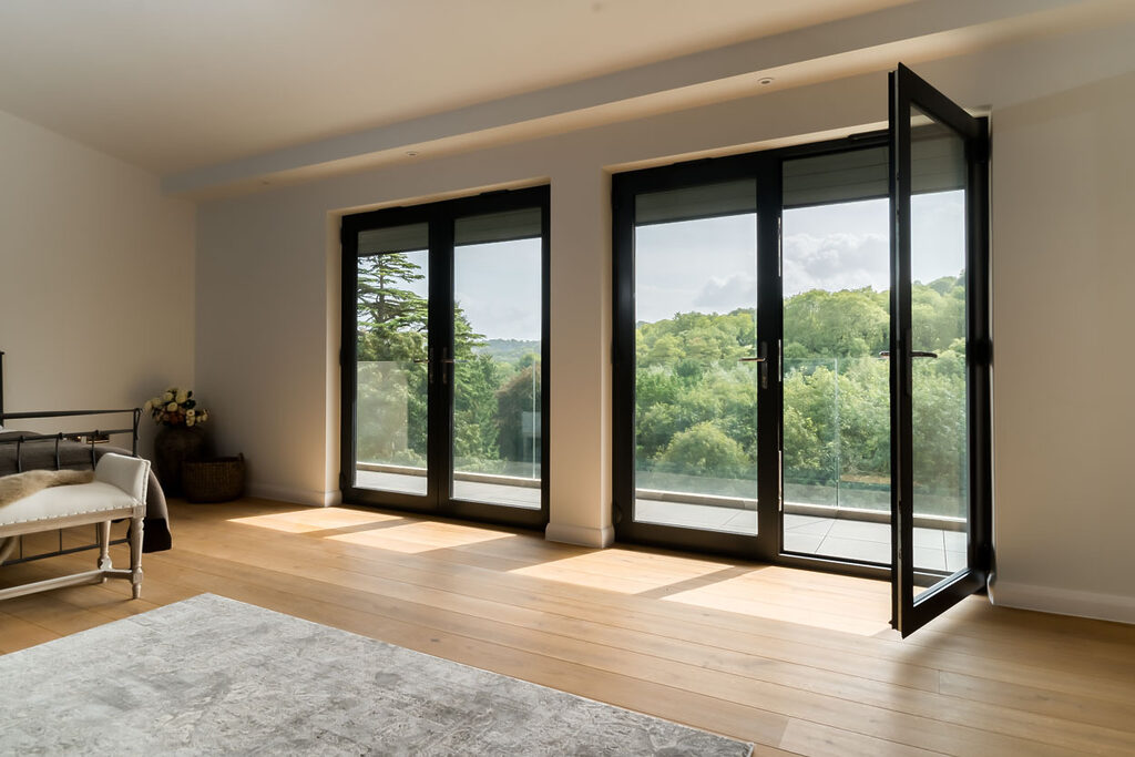 image-2-3 | GFD Homes French doors installed in bedroom, opening onto the balcony.