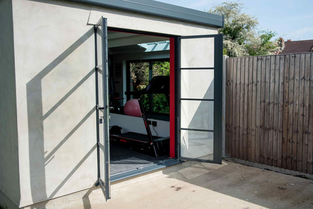 image-3-1 | GFD Homes French doors installed in outbuilding, opening onto the garden.