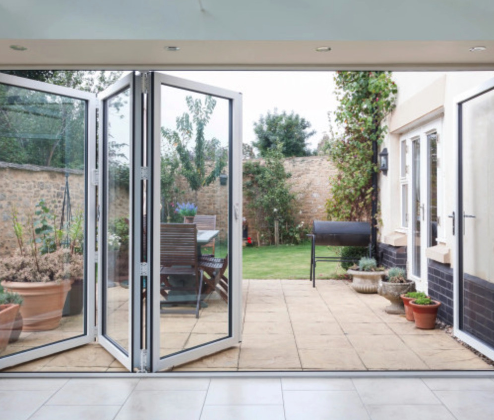 Screenshot-2023-07-17-at-10.14.18 | GFD Homes Bifold doors installed as a patio door, opened halfway.