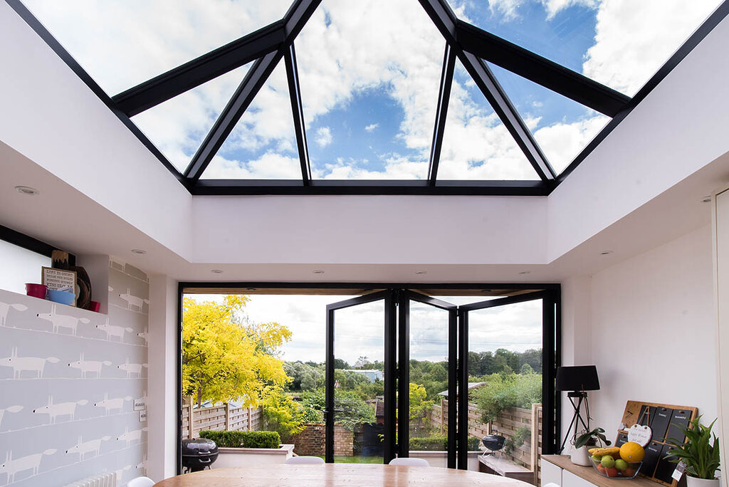 GFD Homes Real Aluminium Bi Fold Doors25 | GFD Homes 3 Panel Smart Bifold installed as a patio door with the garden in view.