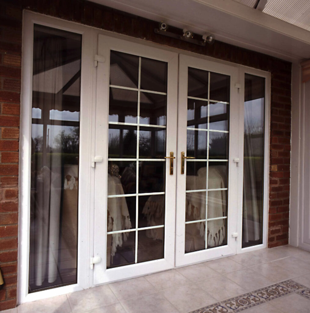 Screenshot-2023-08-25-at-10.09.44 | GFD Homes French doors installed in rear of property to partition the conservatory and living room.