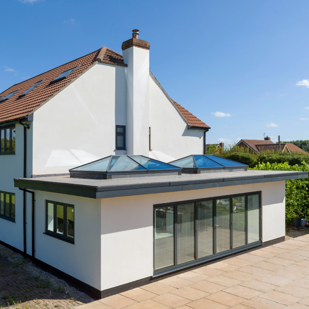 kl-1-large | GFD Homes Side view of a large home featuring 2 Korniche roof lanterns and a Korniche bi-fold.