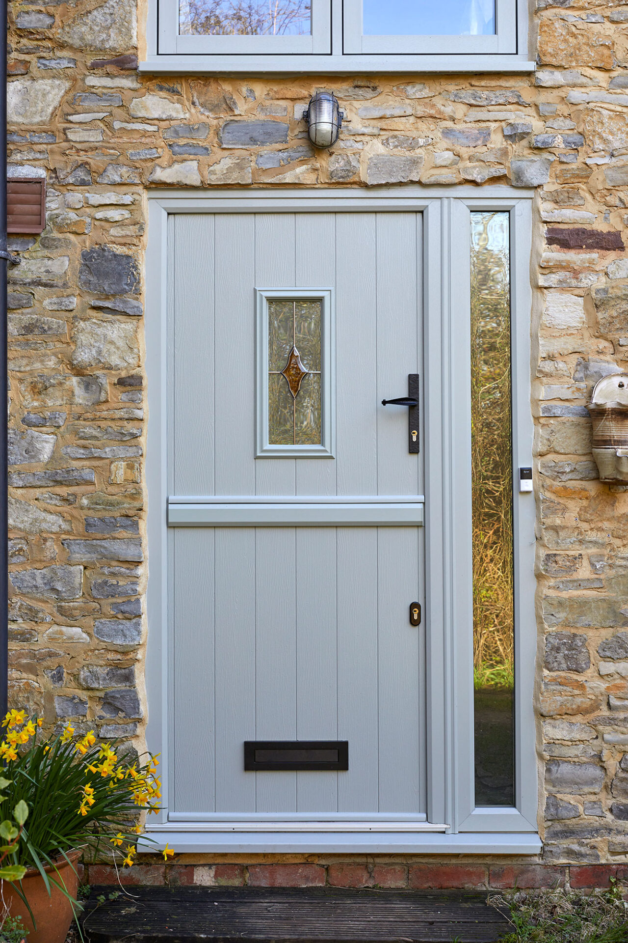GFD Homes A handcrafted Solidor Flint composite door — the perfect blend of cottage charm, traditional detail, and modern durability.