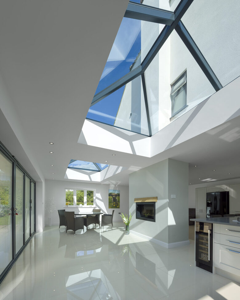 An Atlas aluminium roof lantern from GFD Homes adding natural light and modern elegance to a stylish open-plan kitchen.