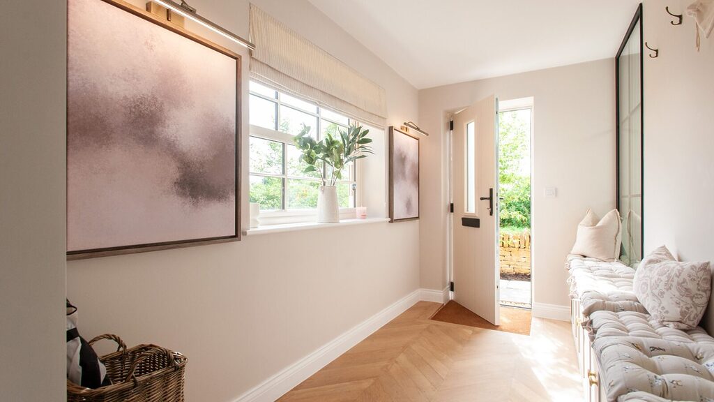 Solidor-Blog-Images-22 | GFD Homes solidor door designer: door open with furniture in the entrance and outside greenery in sight