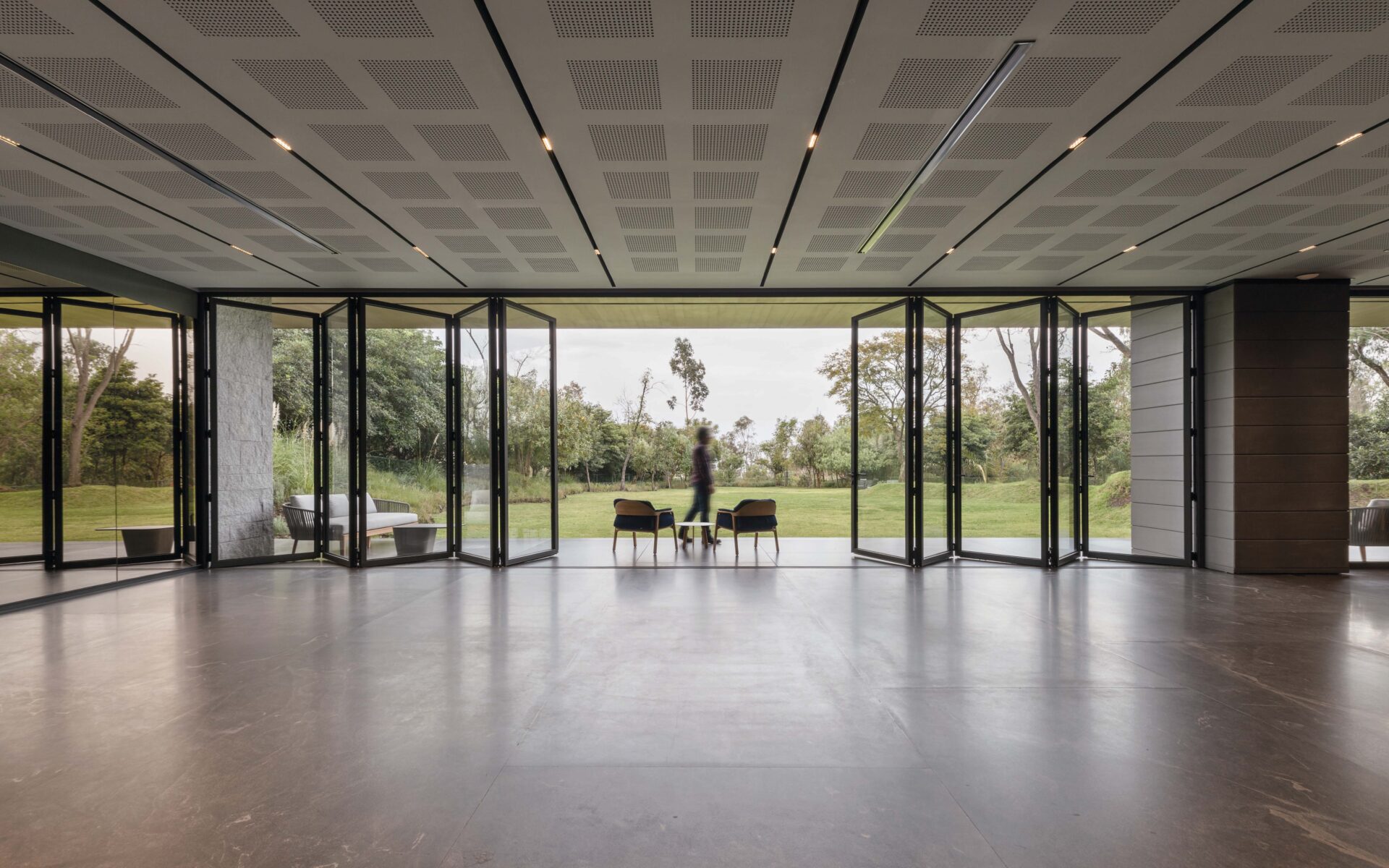 Bifold-Picture | GFD Homes GFD Homes Cortizo aluminium bifold doors and sliding doors opening up a bright, modern living space with slim frames and stunning views