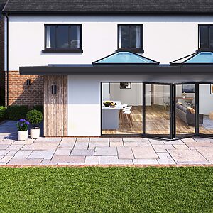 A contemporary home opening onto the garden through modern aluminium patio doors, creating a seamless indoor–outdoor living space.