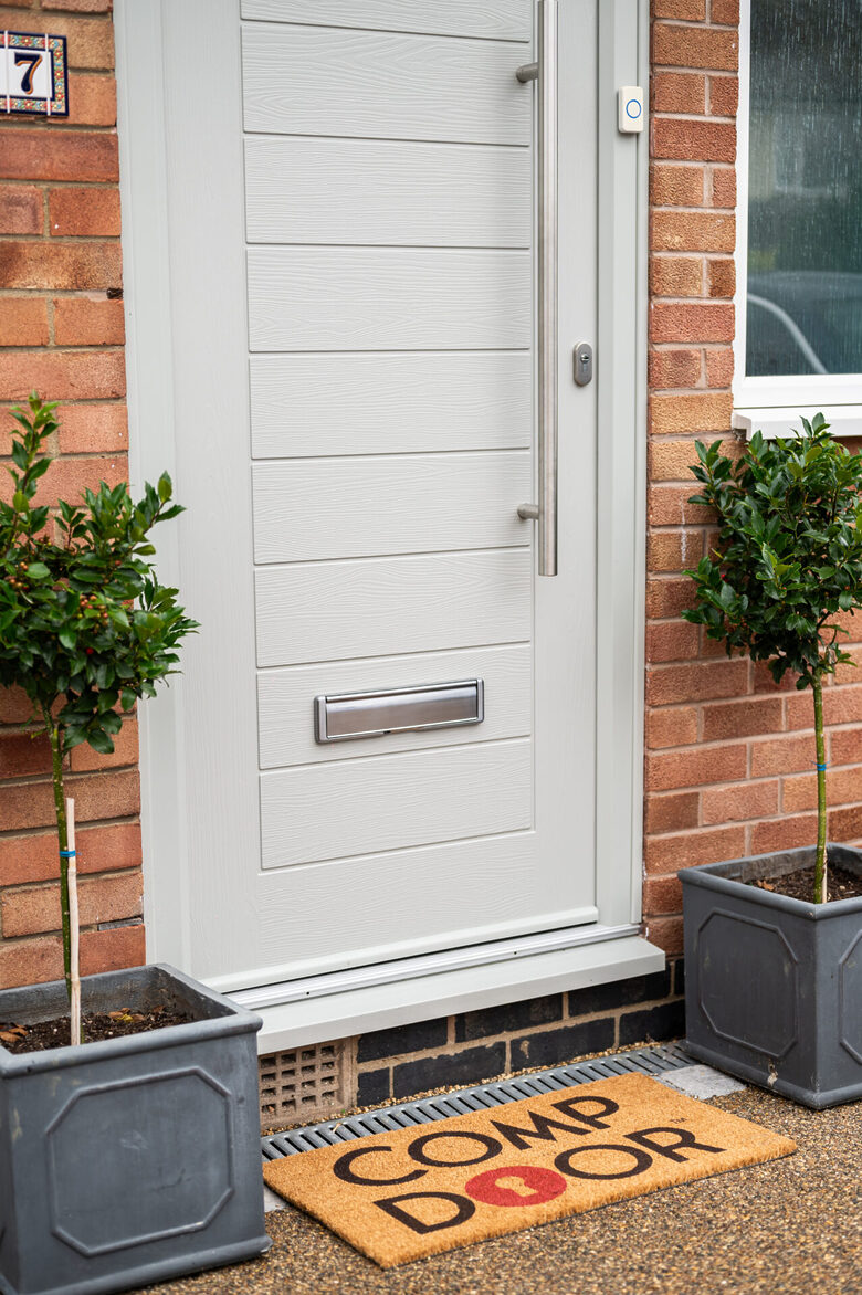 Secure your home in style with a premium solid-core Comp Door from GFD Homes, combining modern timber engineering with striking kerb appeal.