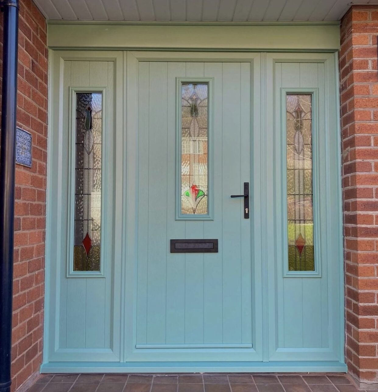 GFD Homes Flood a gloomy hallway with beautiful natural daylight by custom-configuring a premium front door with side panels online with GFD Homes.