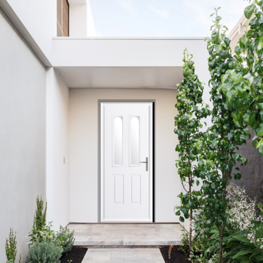 The Comp Door Elmhurst, featuring a softer curved arch glazing panel that adds subtle personality to a classic doorway design.