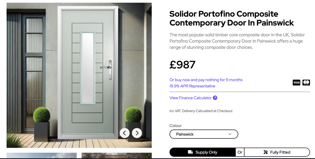 Screenshot 2026-10-19 at 111622 | GFD Homes GFD Homes Modern contemporary front door with vertical rectangular window, set in a grey stucco wall on a wooden deck with two spherical topiary plants in square planters.