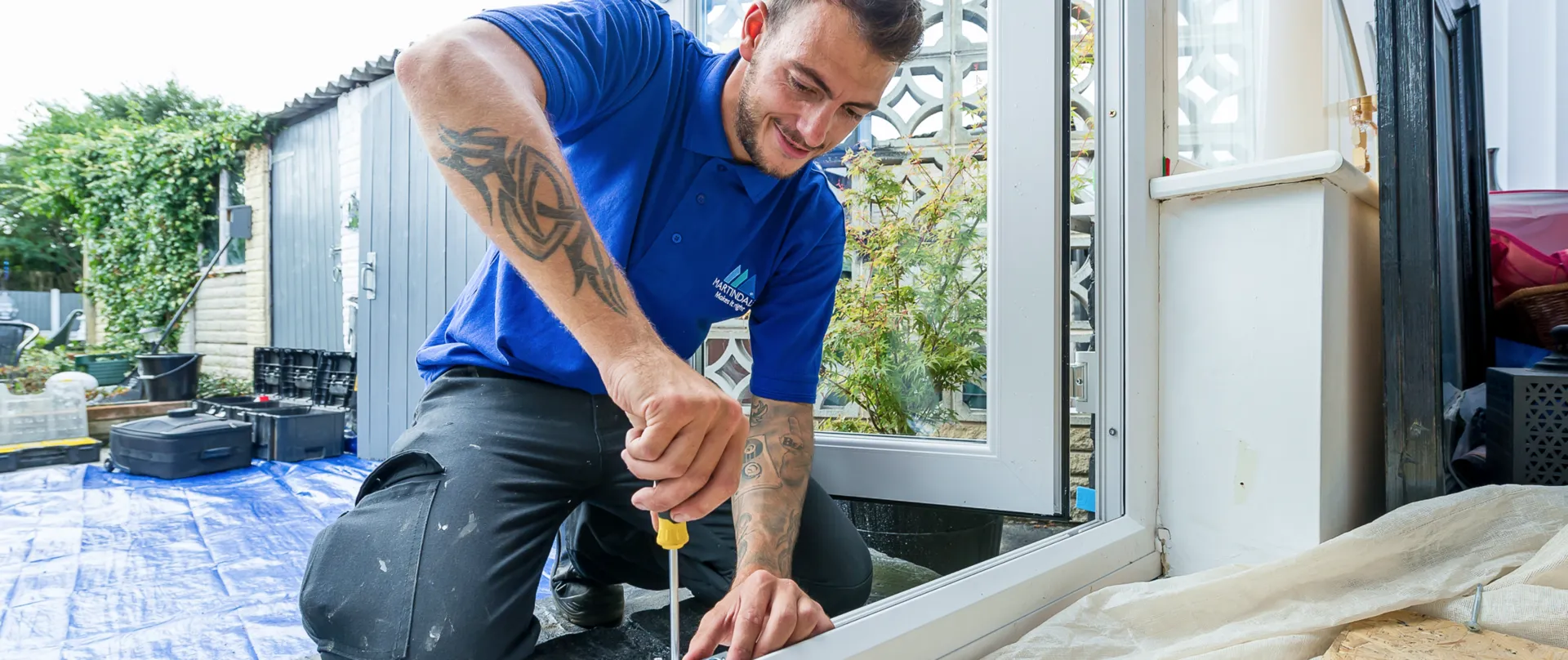Martindales installer fitting a door