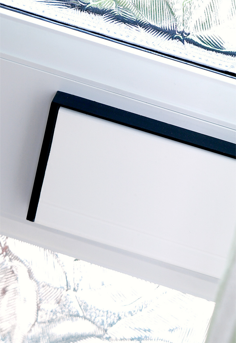 Close up image of a letterbox on a duraflex glazed door.