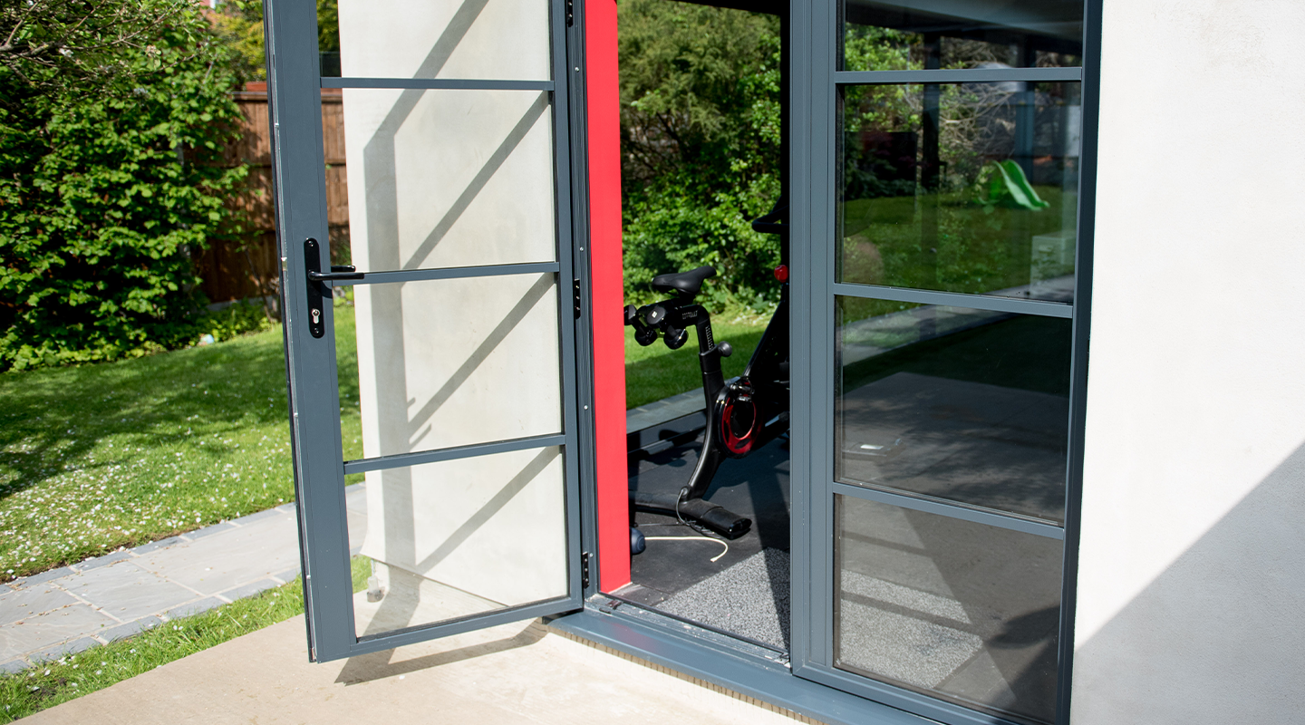 Image of a living room with a industrial style bi-folding door