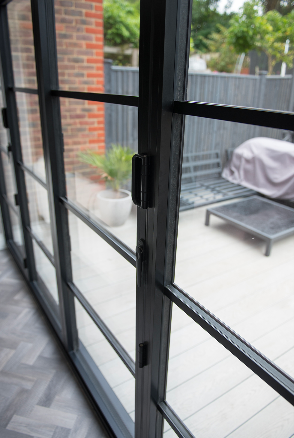 Close up image of a industrial style bi-folding door.