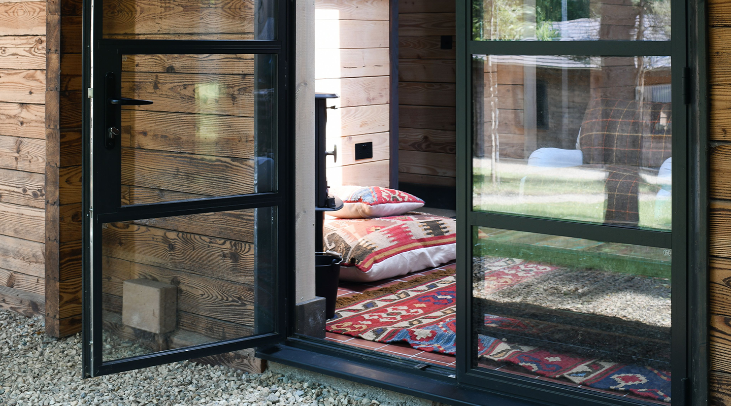 Image of a living room with a industrial style french door